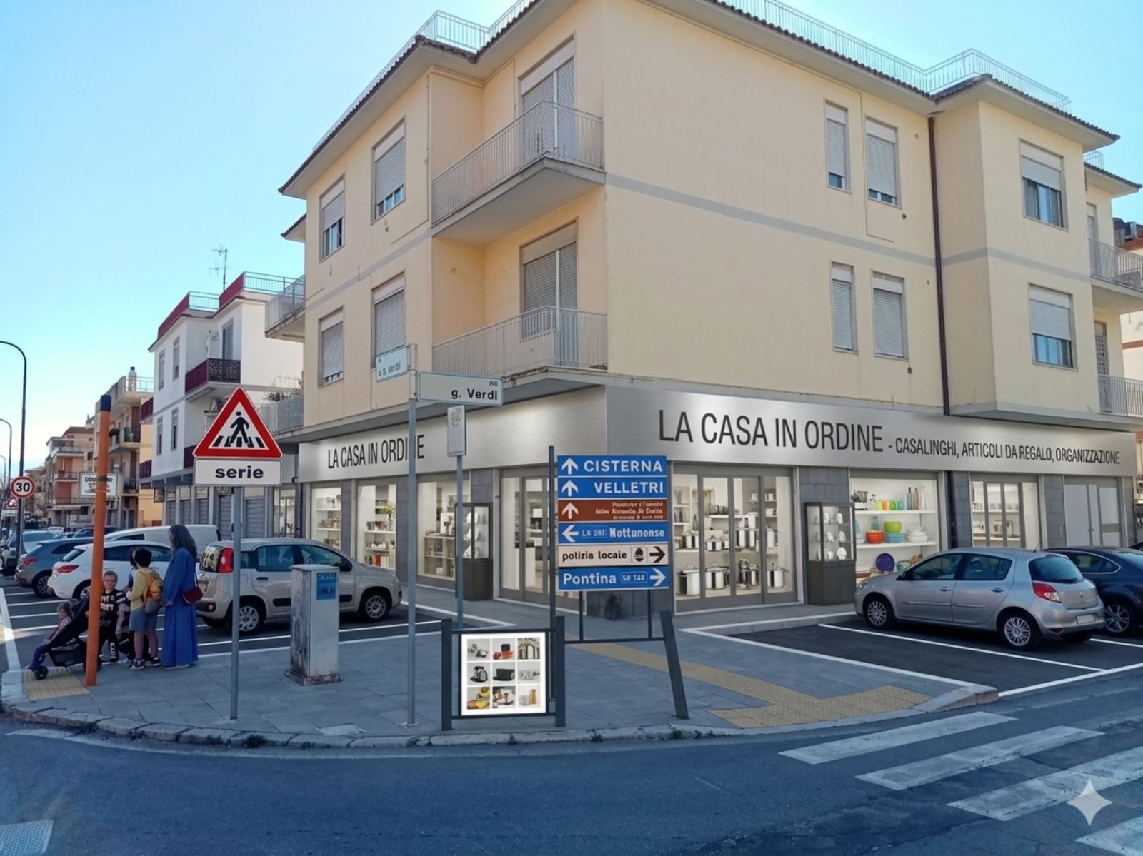 Rendering dell’esterno: negozio di casalinghi sull’angolo con vetrine di pentole e stoviglie